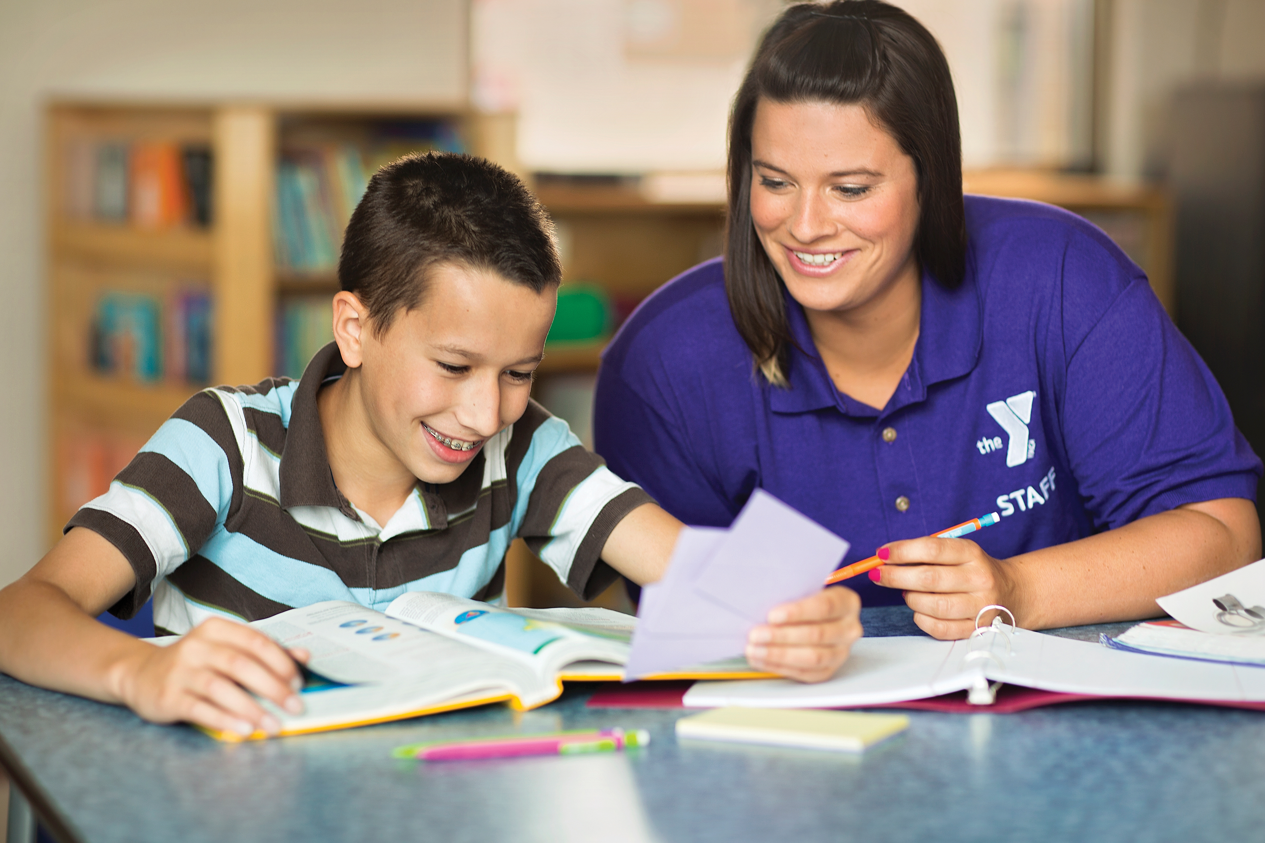 Adult and child working on homework