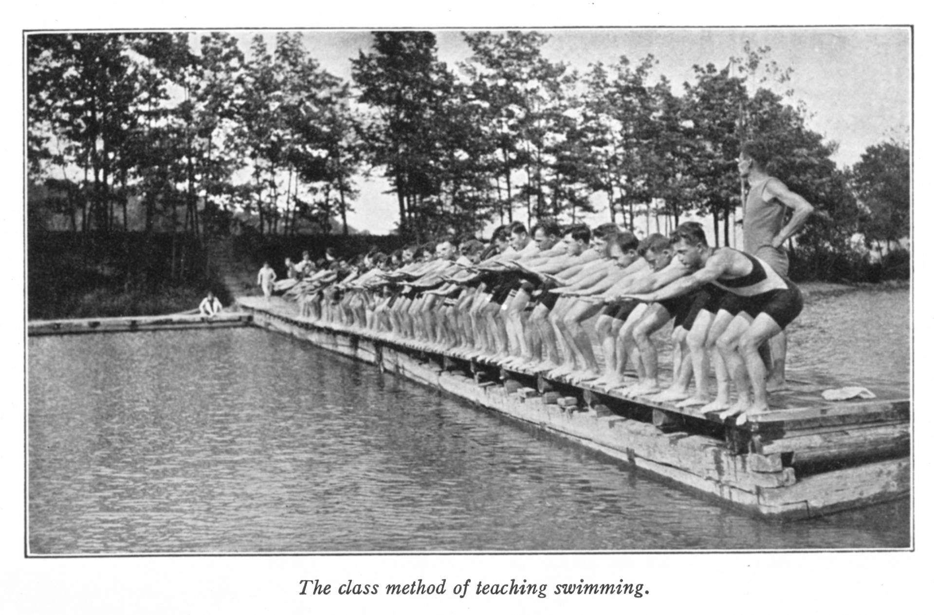 Men on lake learning to swim in 1909