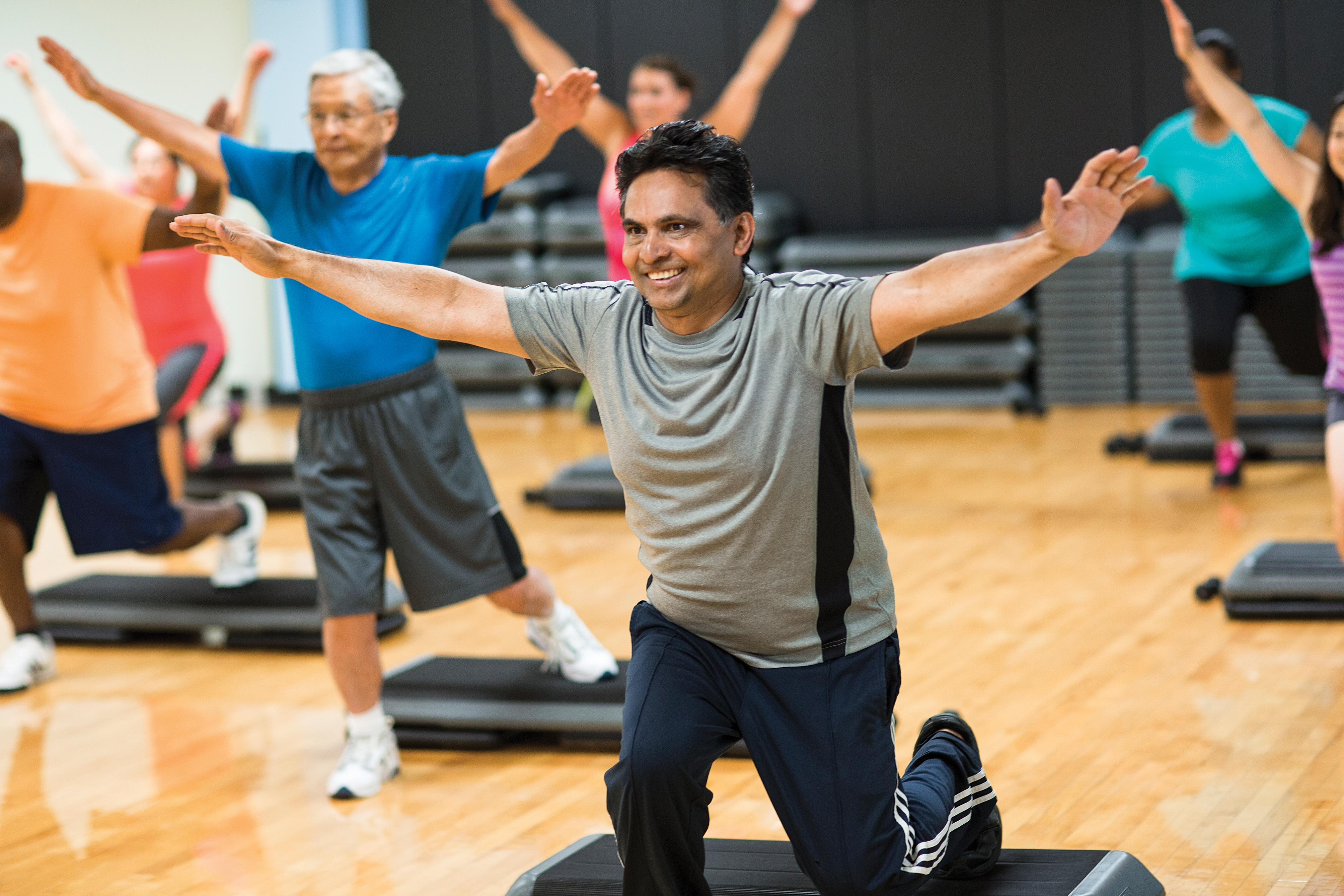 YMCA gym member enjoying a workout class