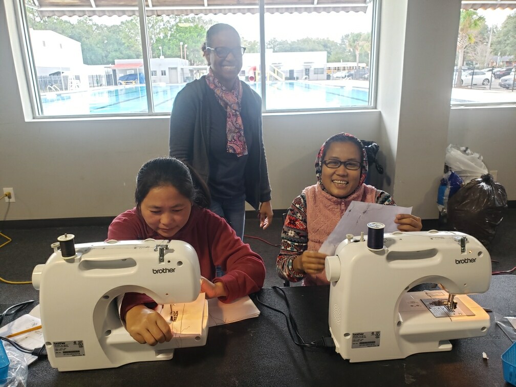 women attending sewing class at the YMCA women attending sewing class at the YMCA