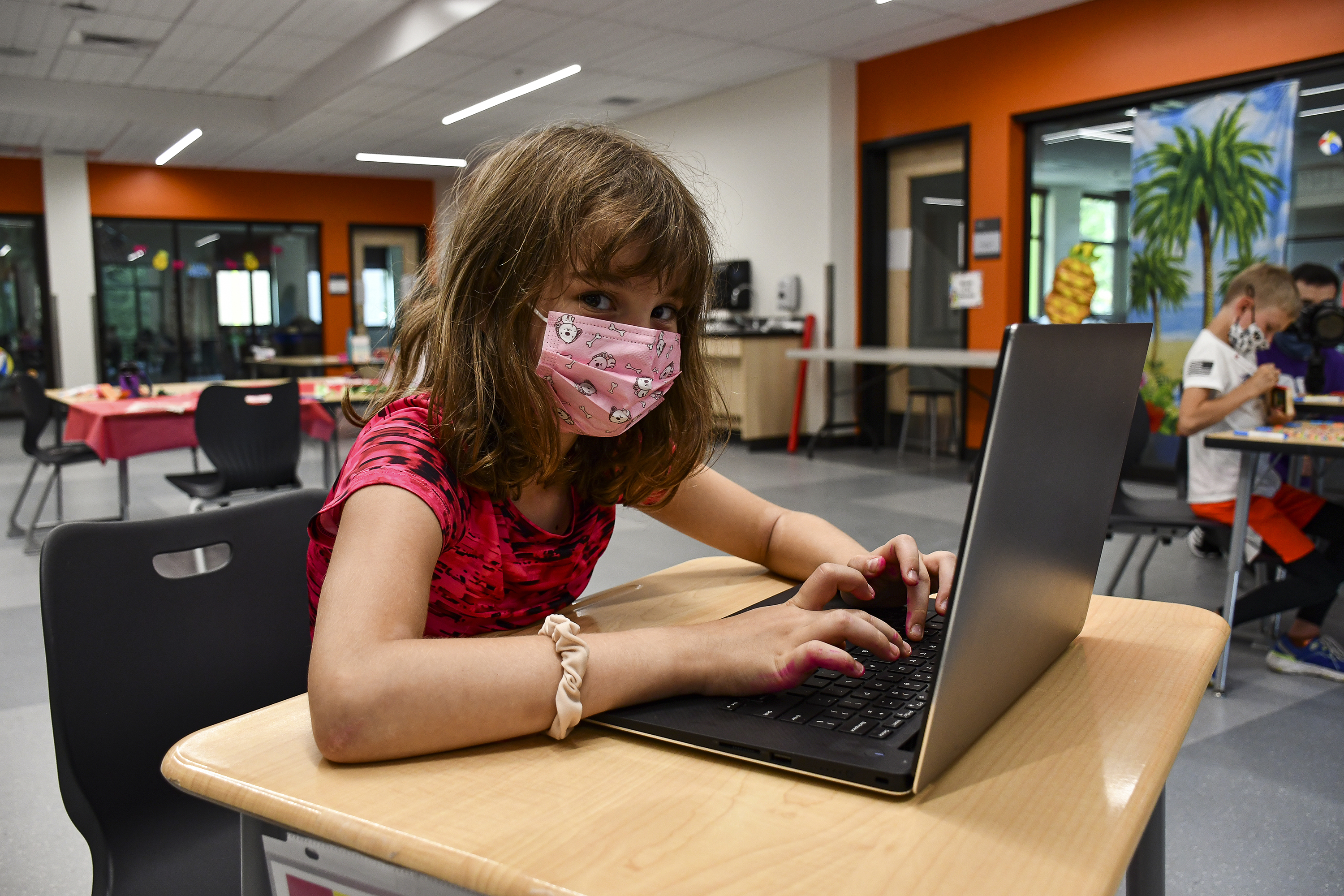 Child taking virtual learning courses online at a YMCA
