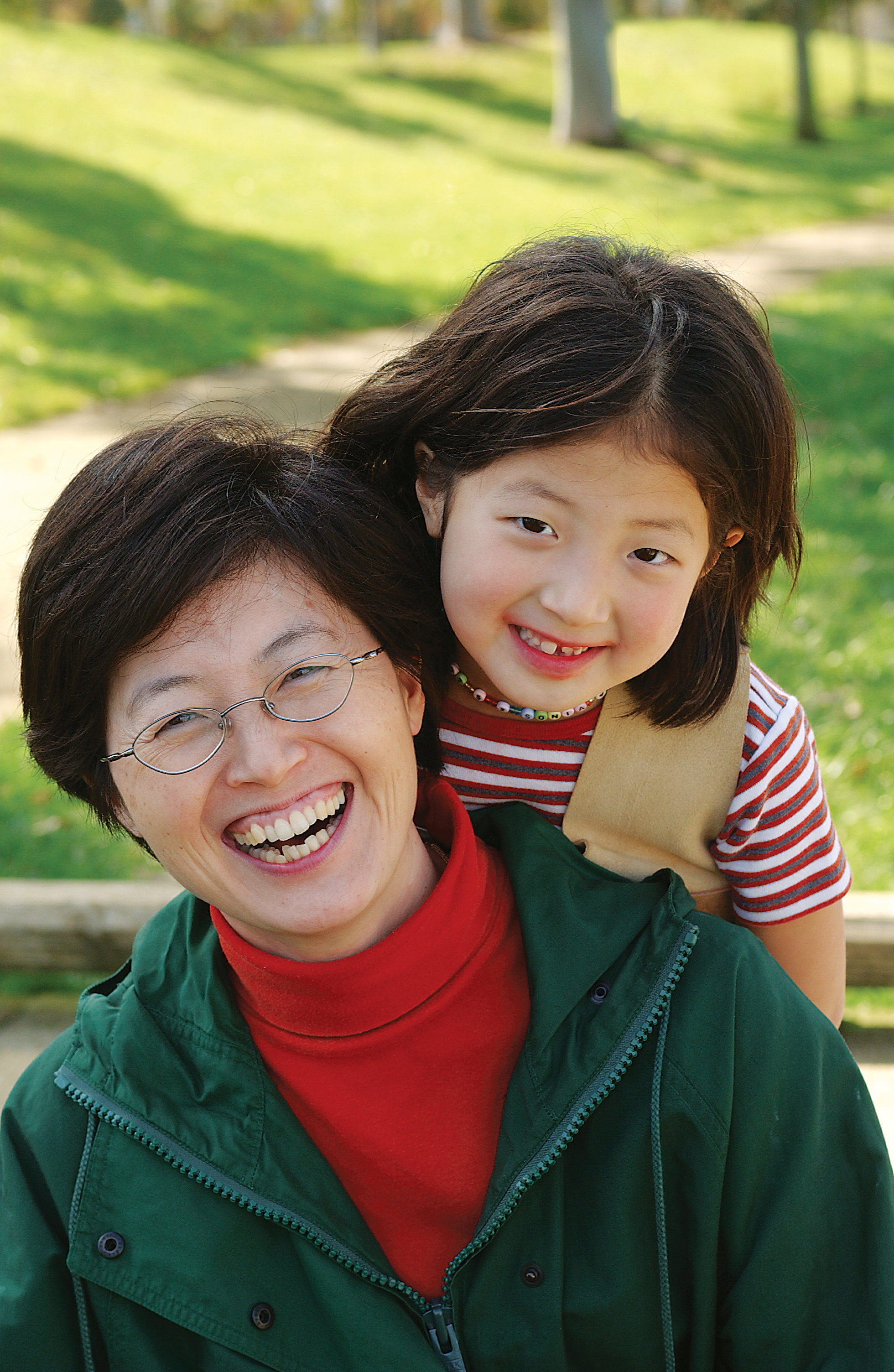 Mother and daughter posing in park - YMCA Mother and daughter posing in park - YMCA