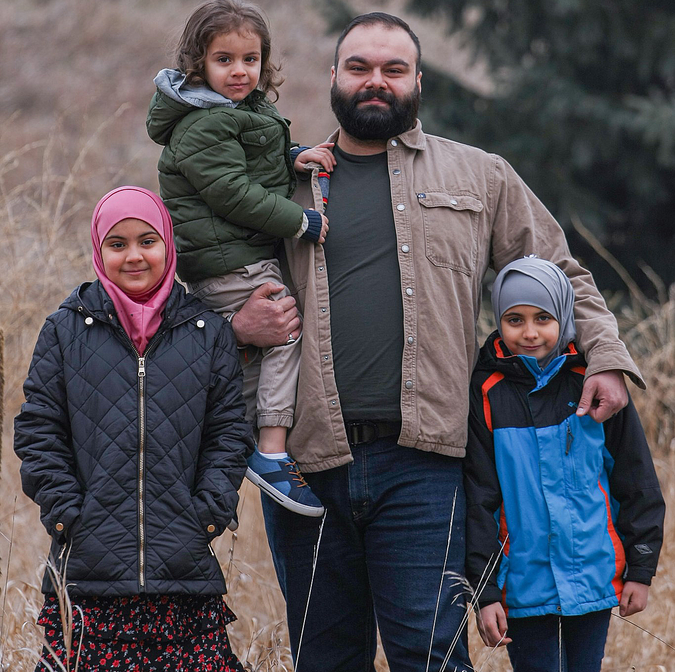 Family of four posing - YMCA