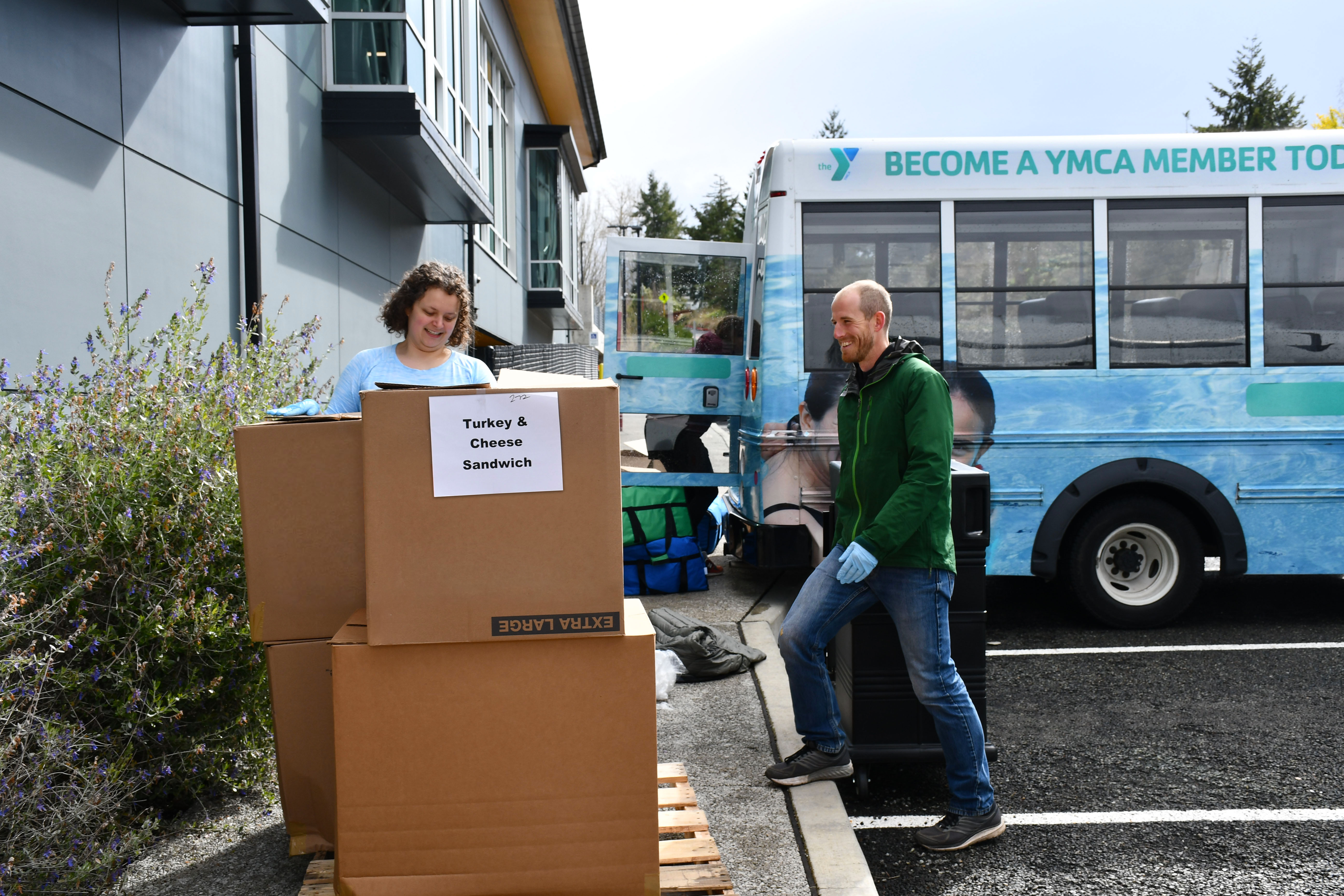 YMCA volunteers unloading food to donate YMCA volunteers unloading food to donate