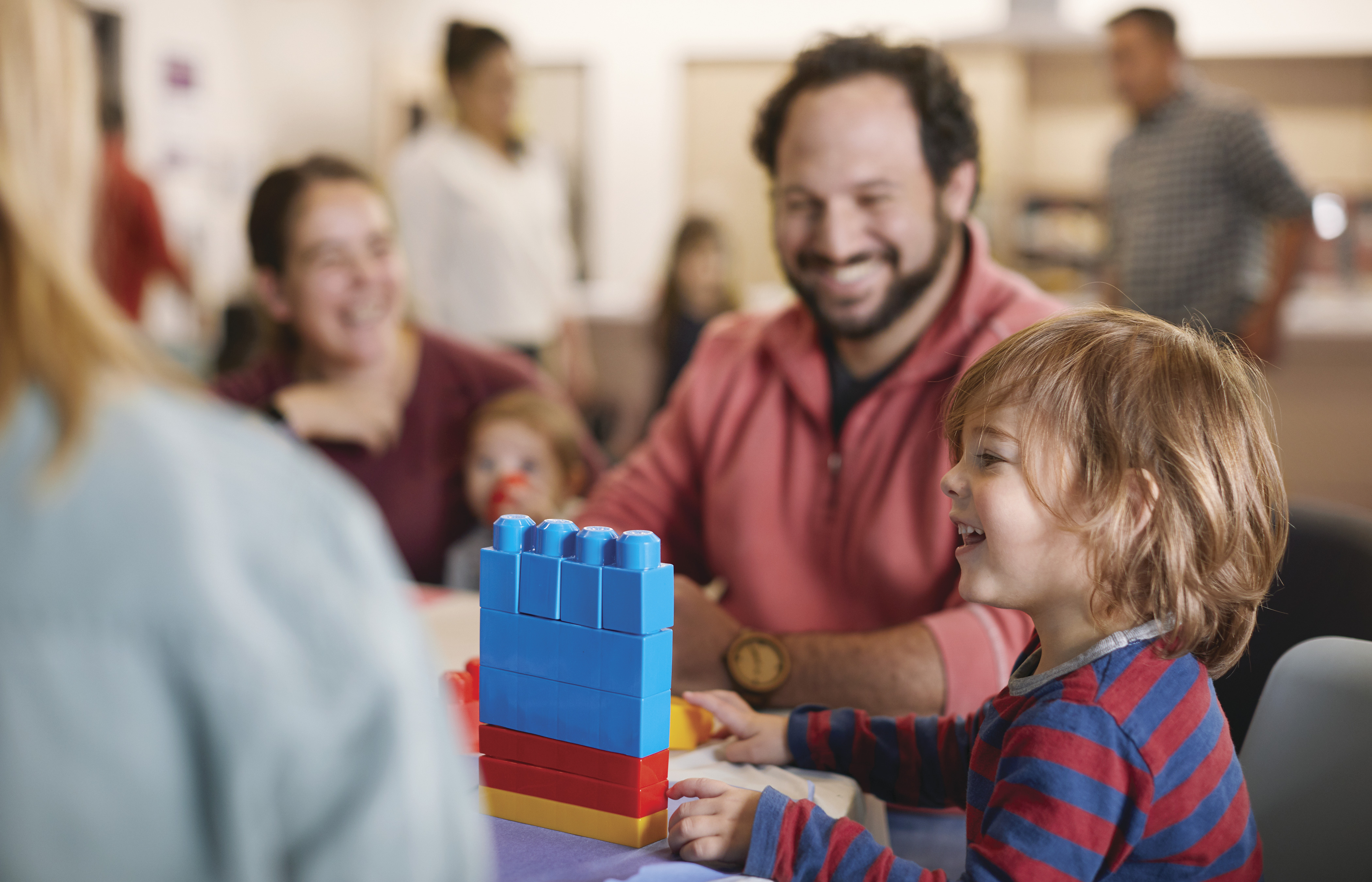Parent and child playing table games at YMCA