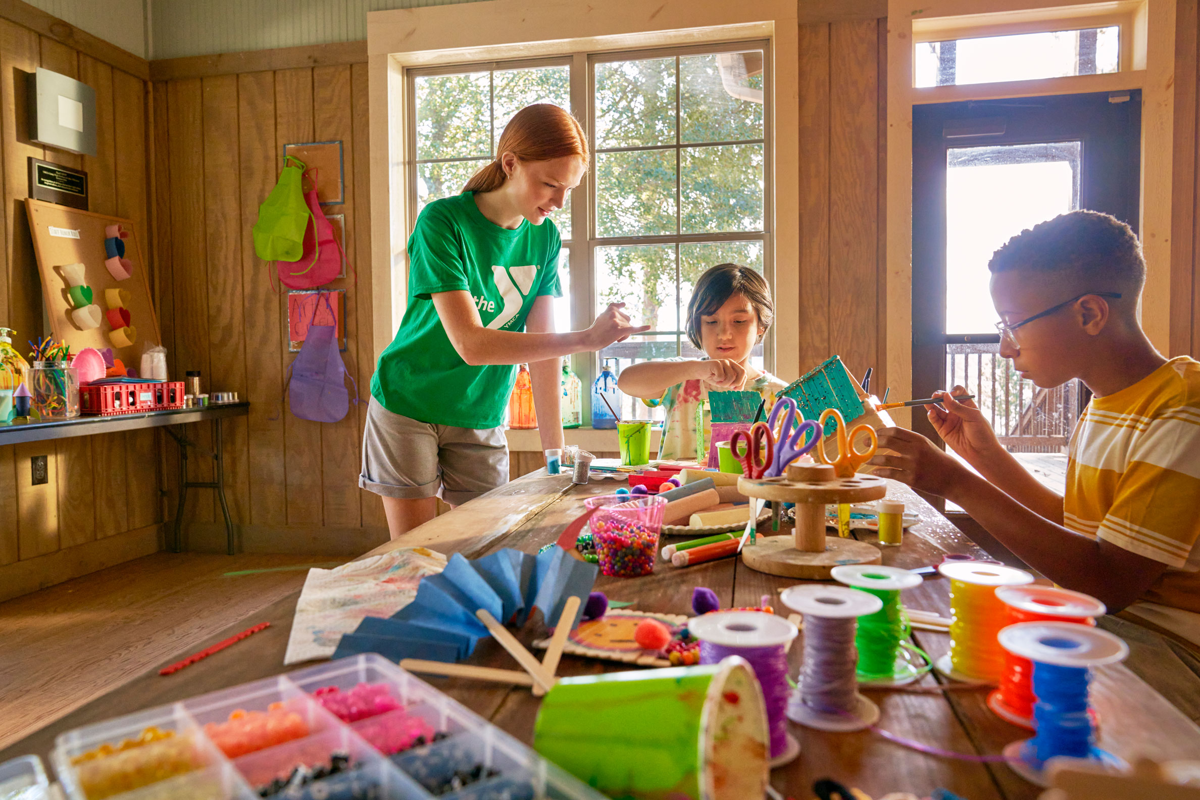 Boy and a girl doing arts and crafts at Day camp Boy and a girl doing arts and crafts at Day camp