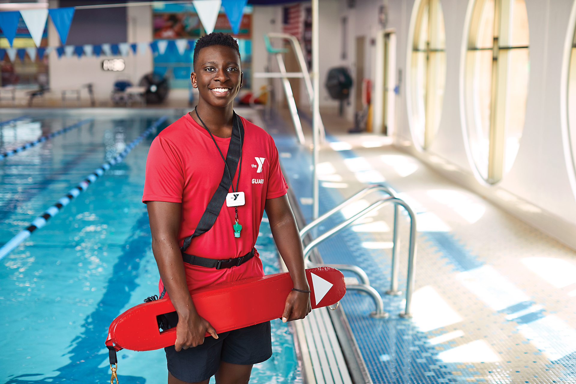 Smiling male lifeguard Smiling male lifeguard
