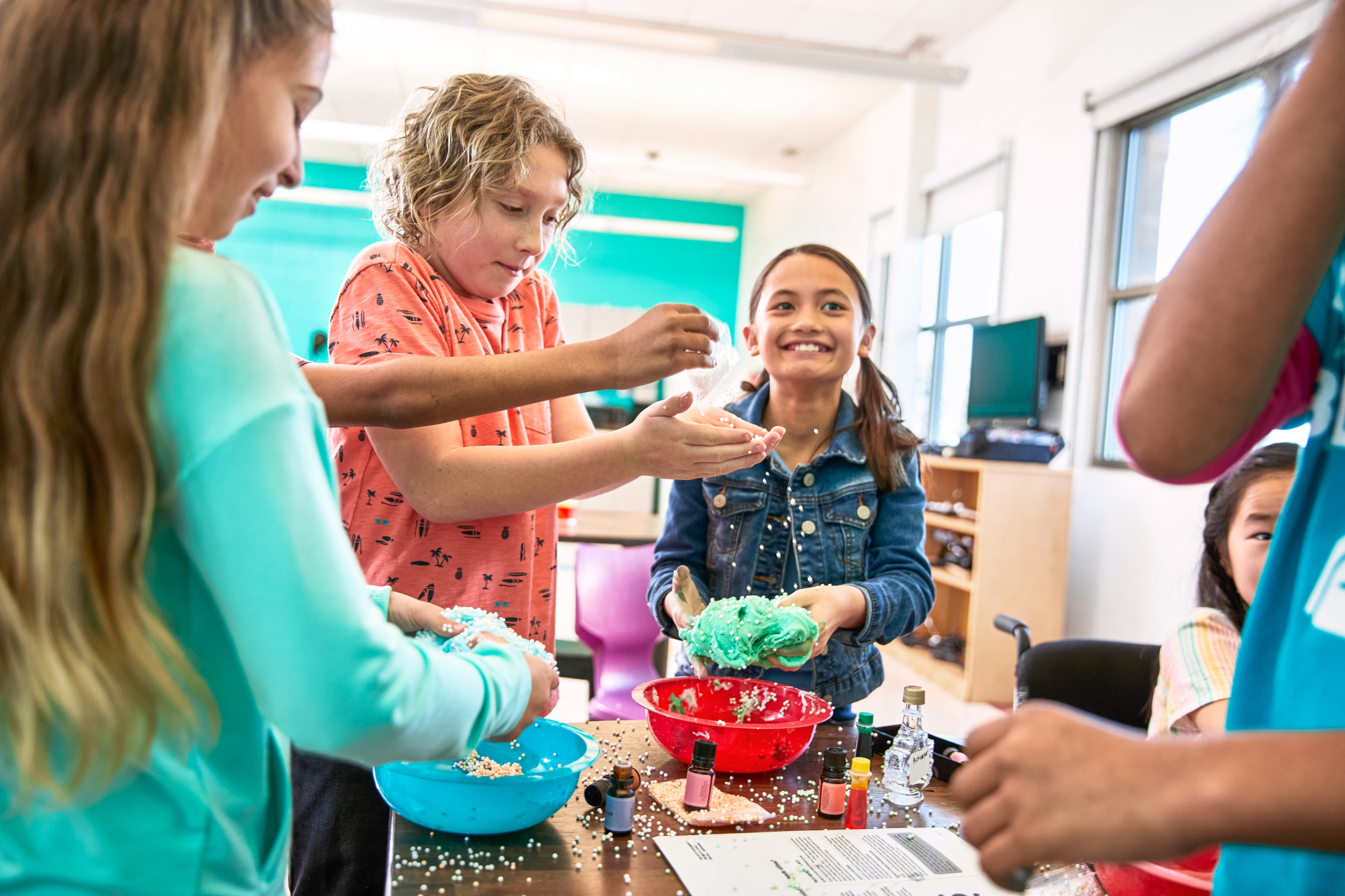 Kids smiling and engaged in a STEM experience at the Y Kids smiling and engaged in a STEM experience at the Y