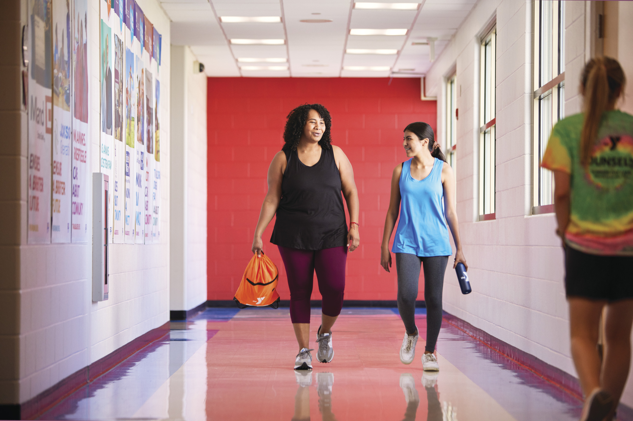 Mother and daughter entering a YMCA together Mother and daughter entering a YMCA together