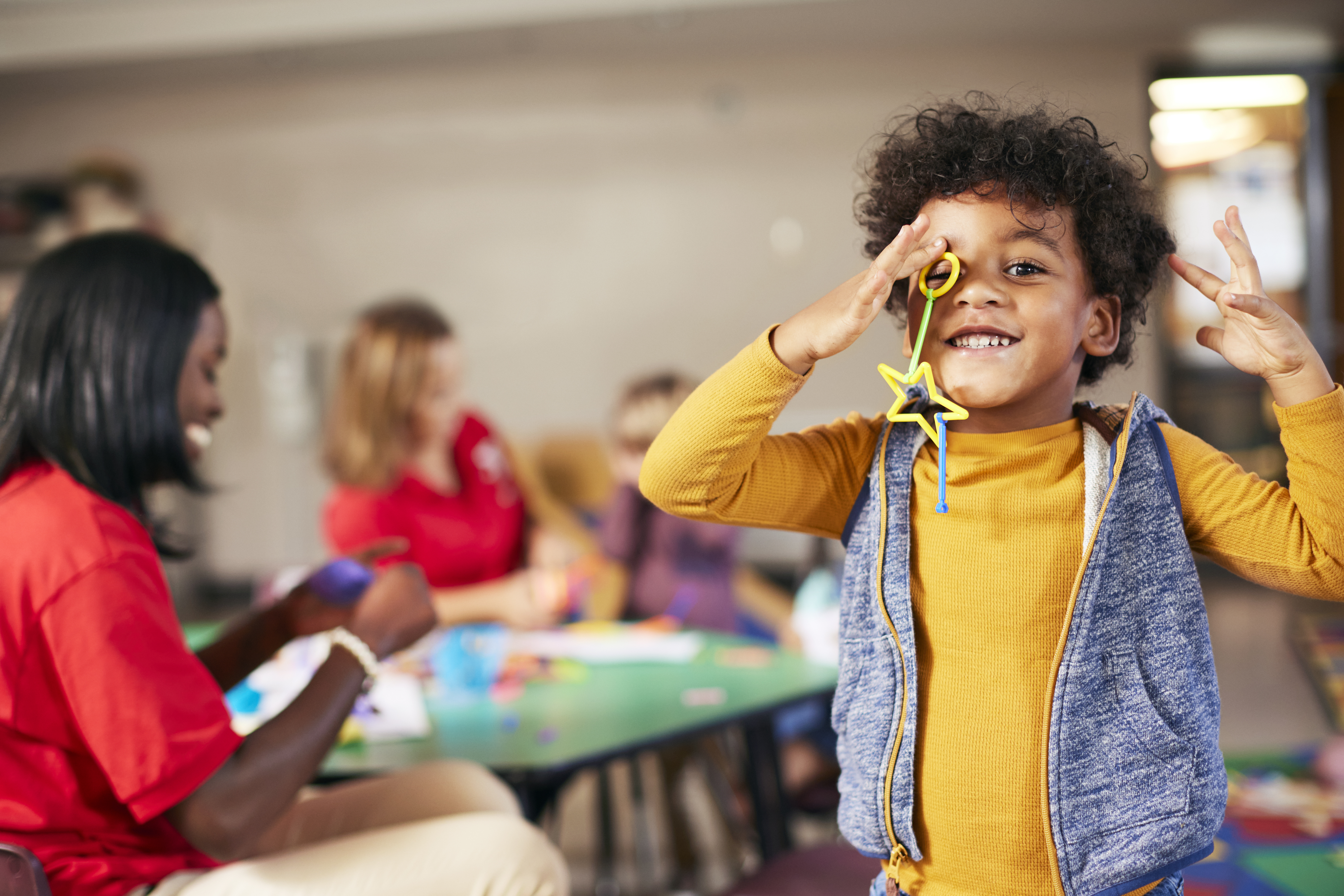 Y youth member playing with STEM activity in a classroom