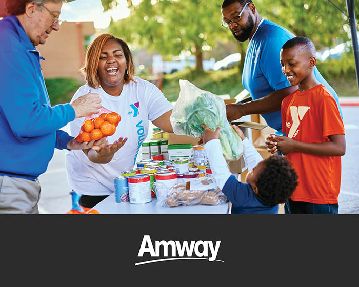Volunteers distributing food with Out-of-School-Time program. Volunteers distributing food with Out-of-School-Time program.