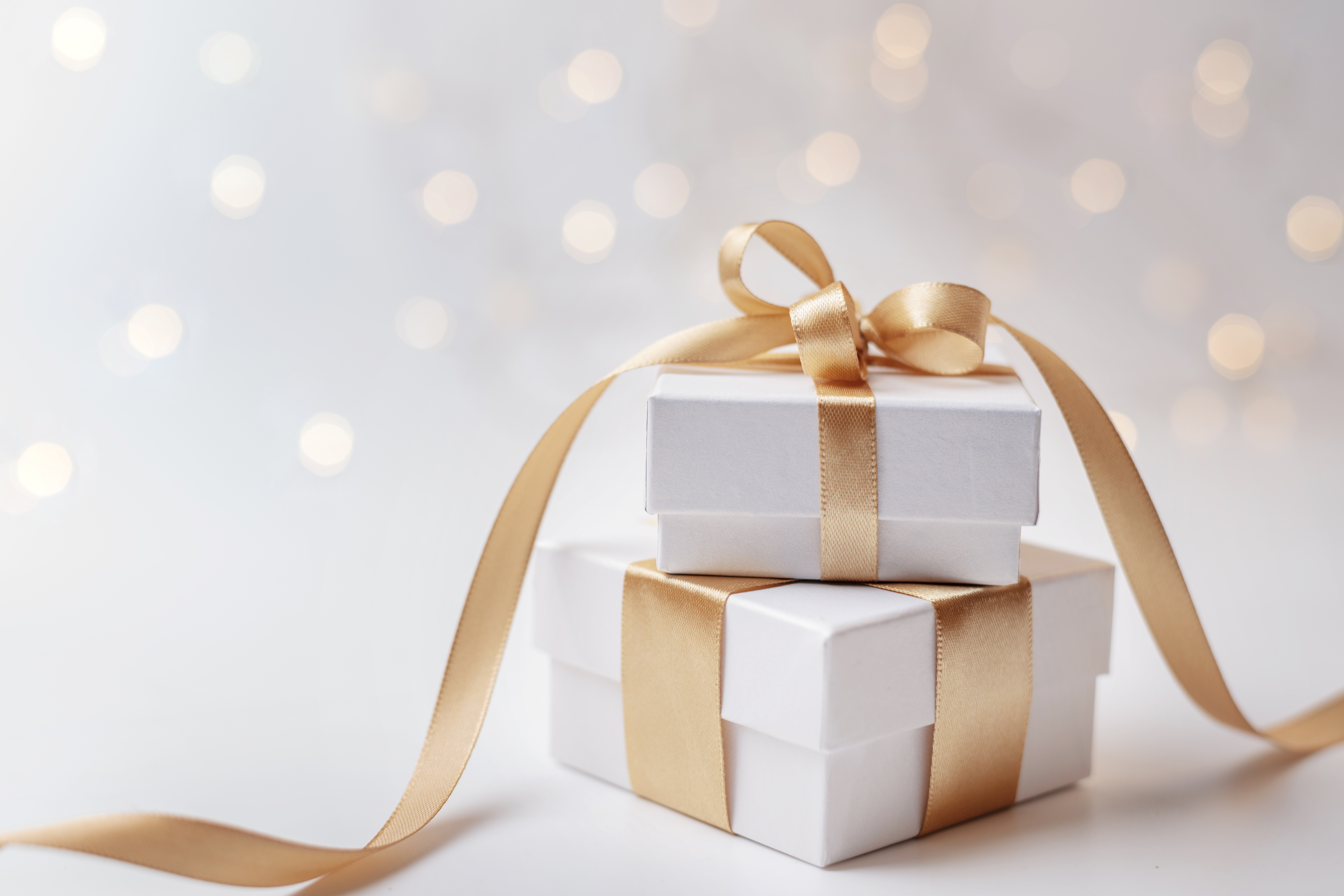 Wrapped present qith gold ribbbn Wrapped present qith gold ribbbn