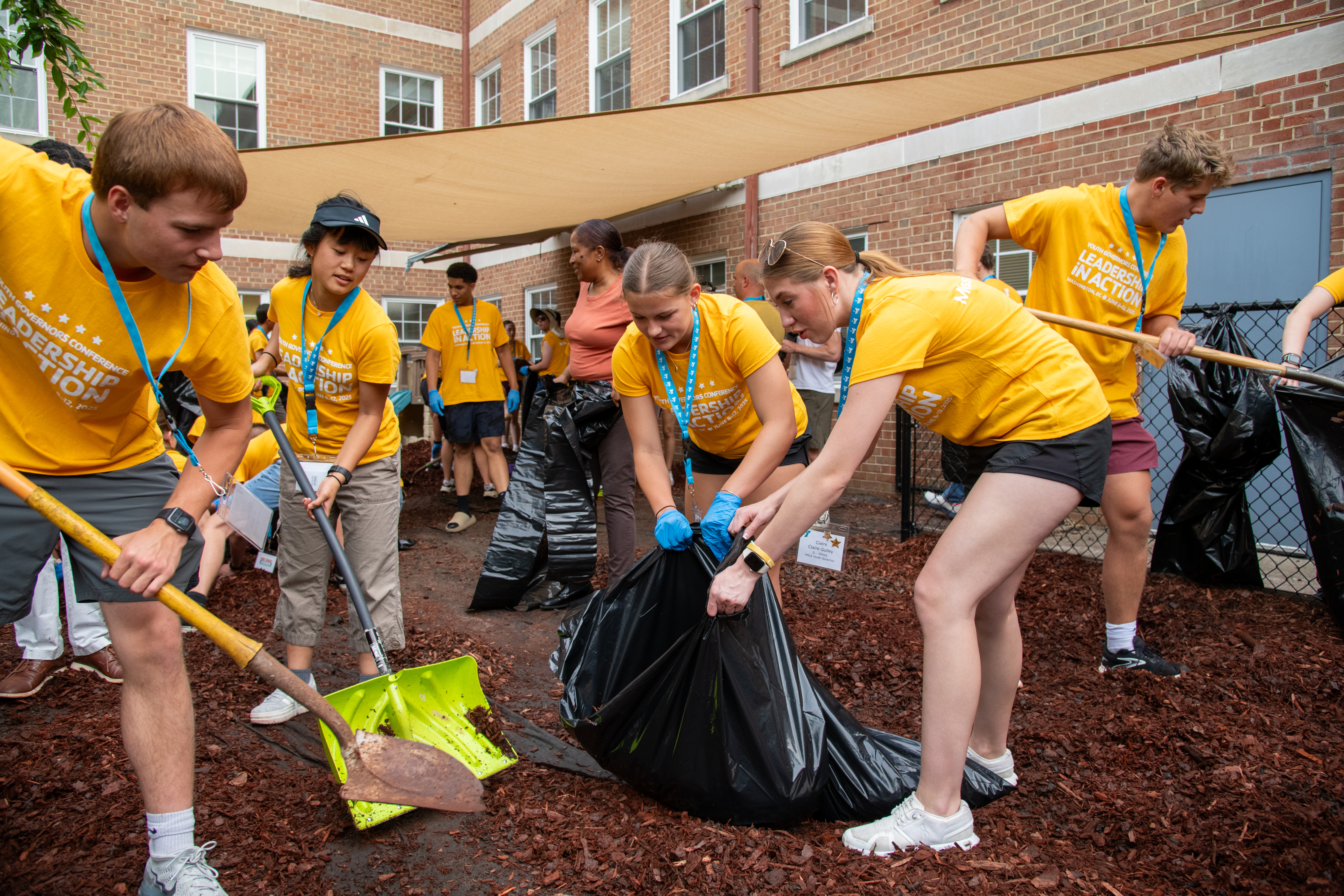 YMCA youth volunteers working outside YMCA youth volunteers working outside