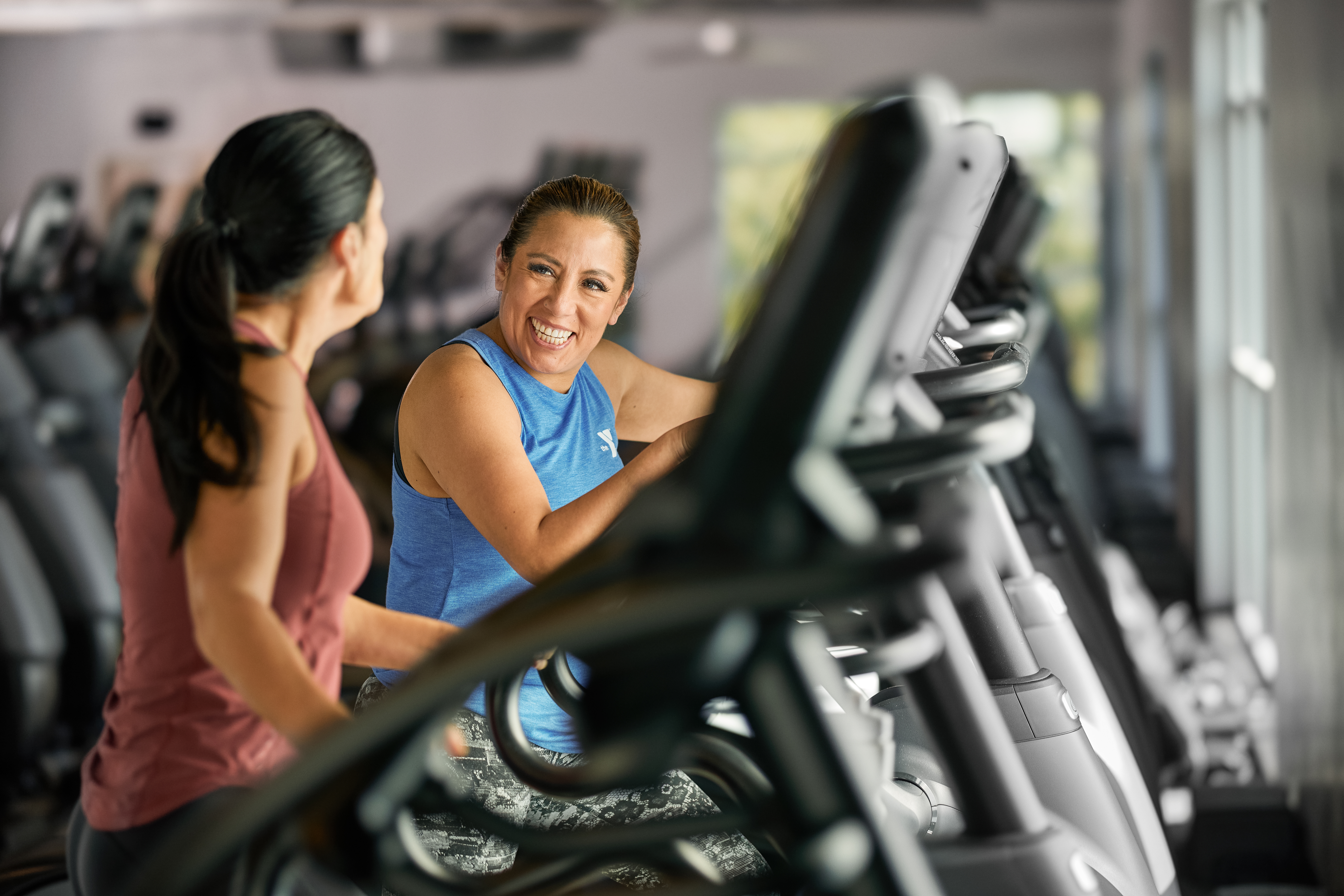 Two women using treadmills at the YMCA