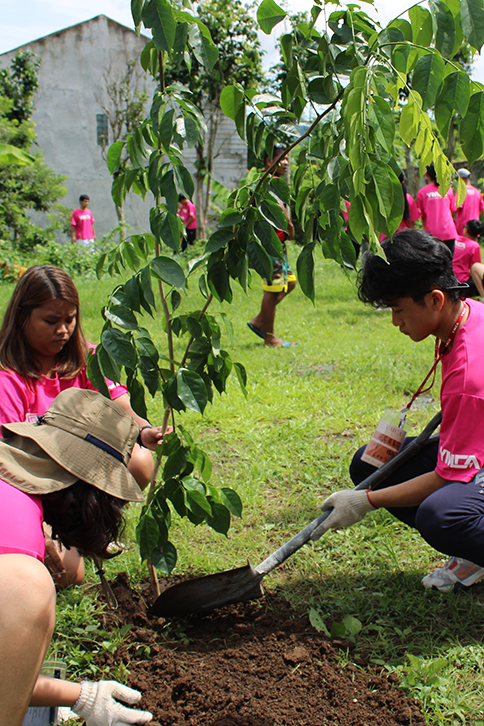 Teens planting trees.