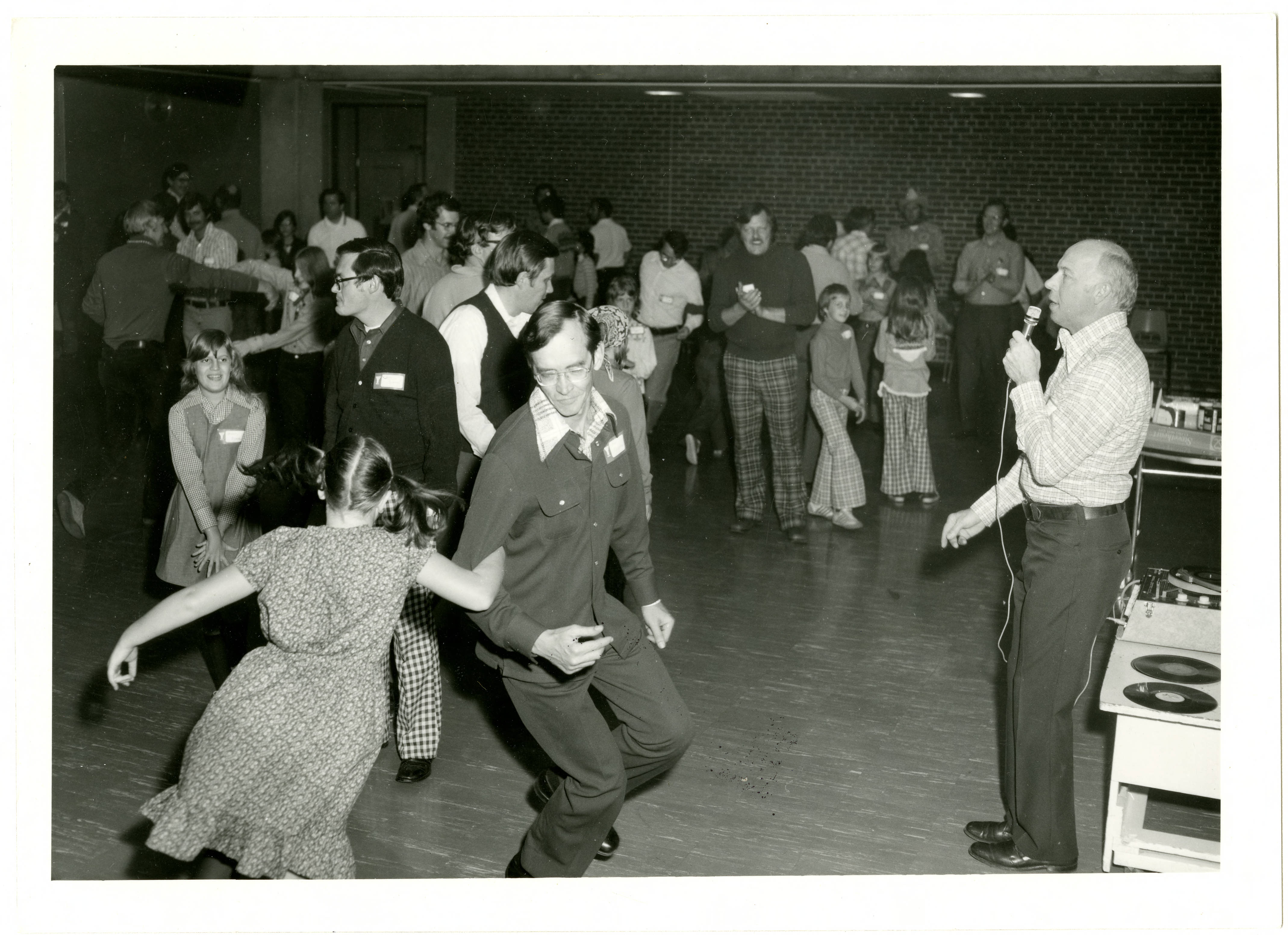 Black and white photo of a father daughter dance