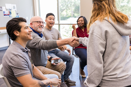 A group of people gain support at a YMCA
