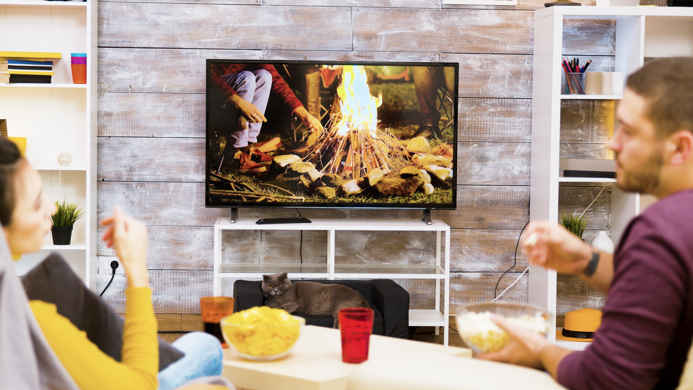People sitting in front of a virtual campfire