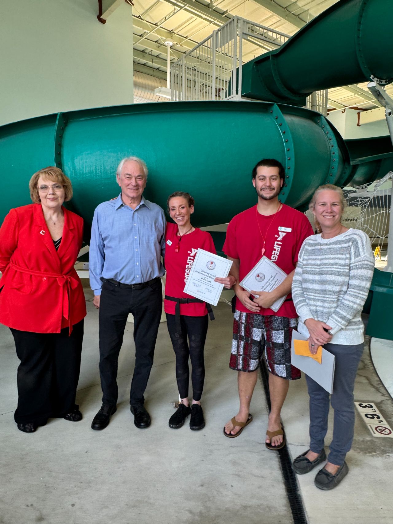 A group of YMCA lifeguards receive a lifesaving award