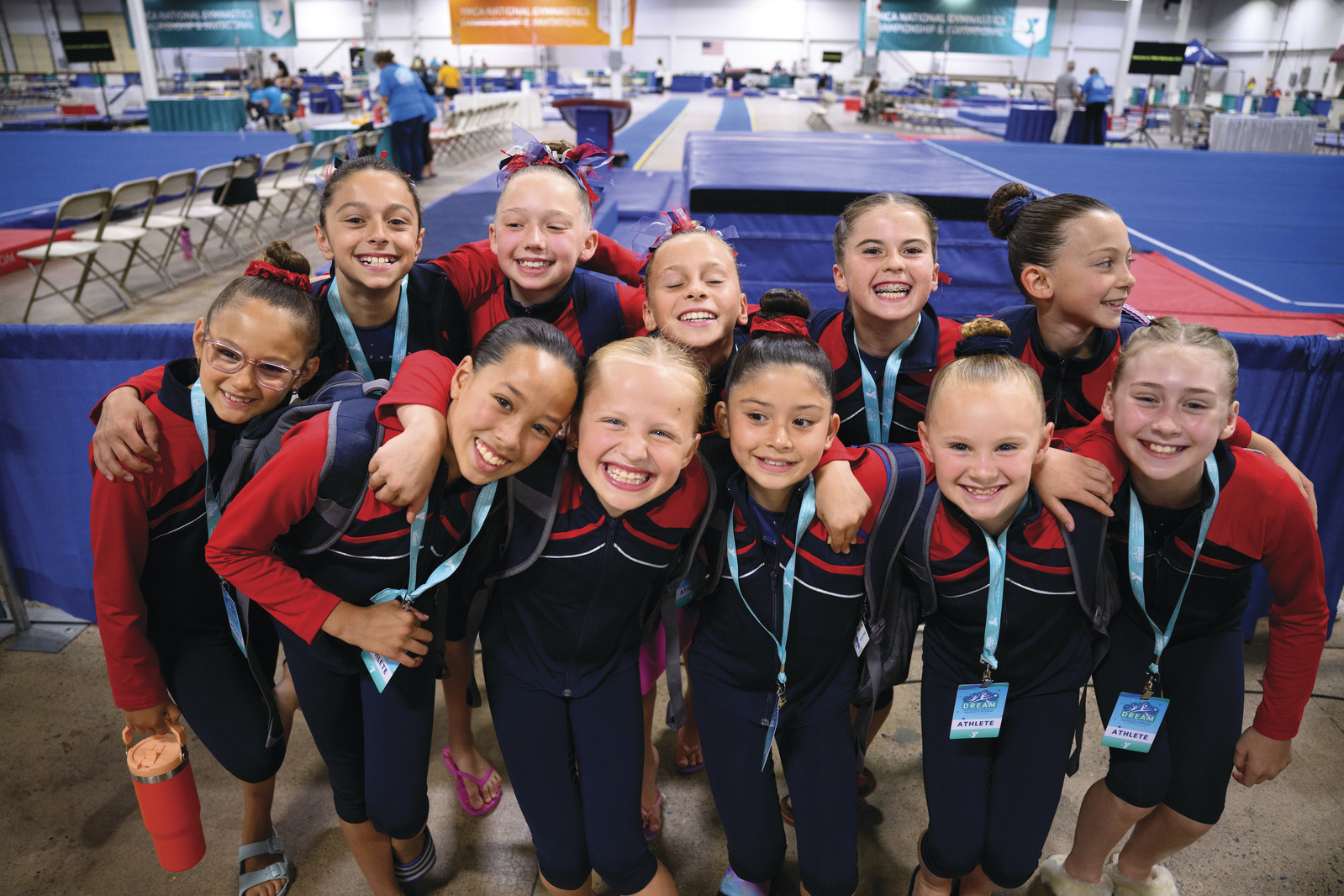 YMCA gymnastics athletes pose at a past YMCA Championship