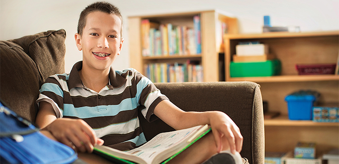 Teenager reading a book