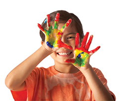Young kid with paint on his hands