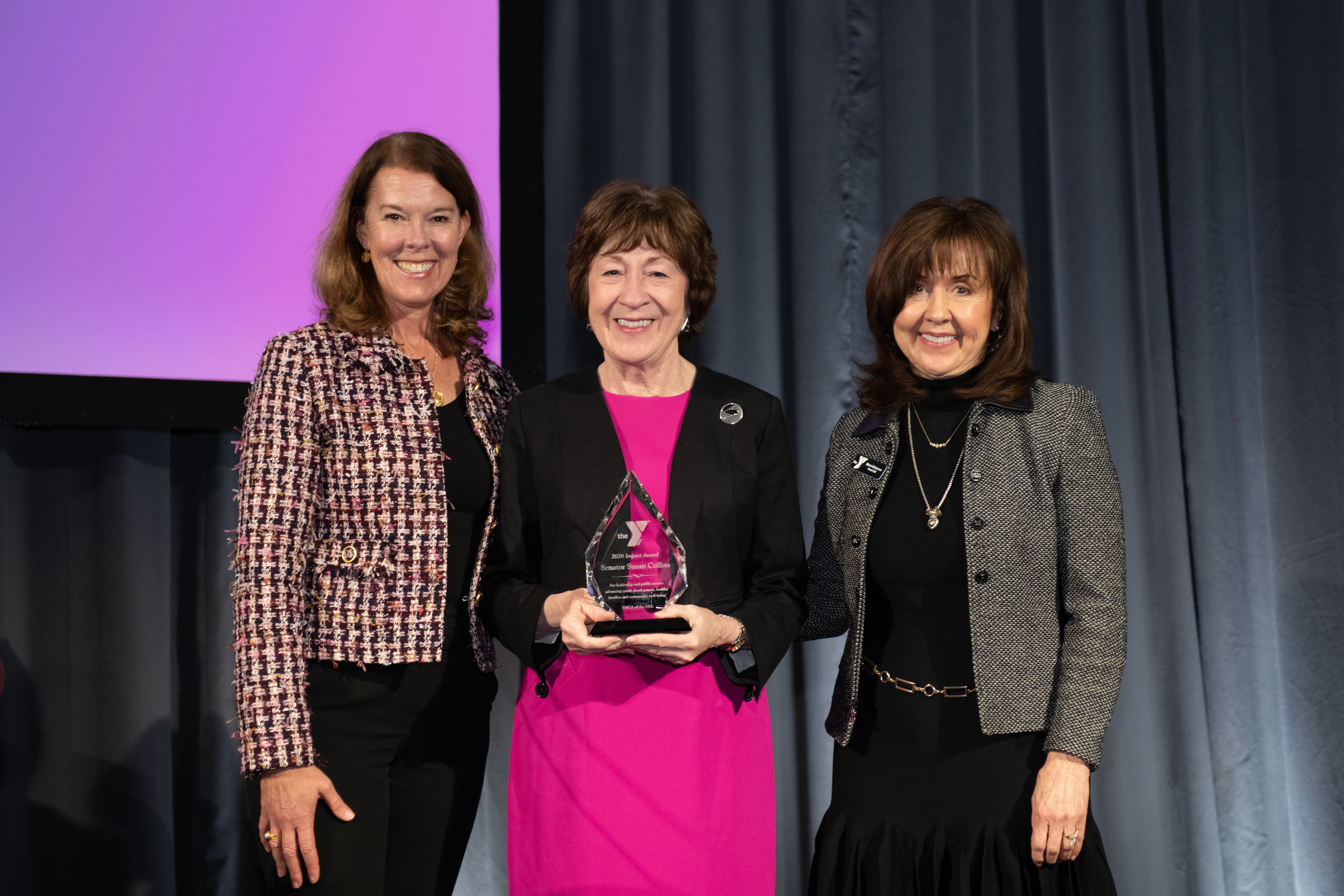 Suzanne McCormick (President and CEO, YMCA of the USA), U.S. Senator Susan Collins (R-ME) and Diane Dickerson (CEO, Bangor Region YMCA) pose as Senator Collins was presented the 2026 Y-USA Impact Award