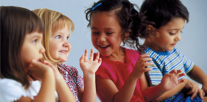 Four children smiling
