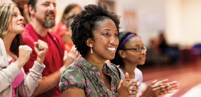Woman applauding in the audience