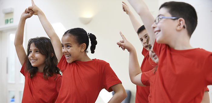 Kids in red T-shirts dancing