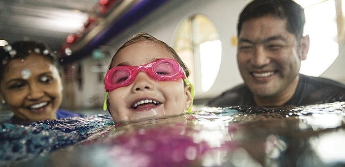 Child and adult swimming