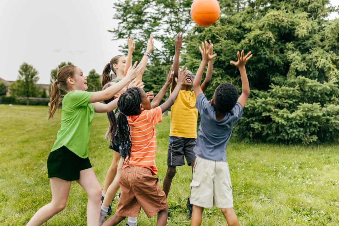 Kids playing with a ball outside