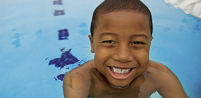 Smiling child in the pool