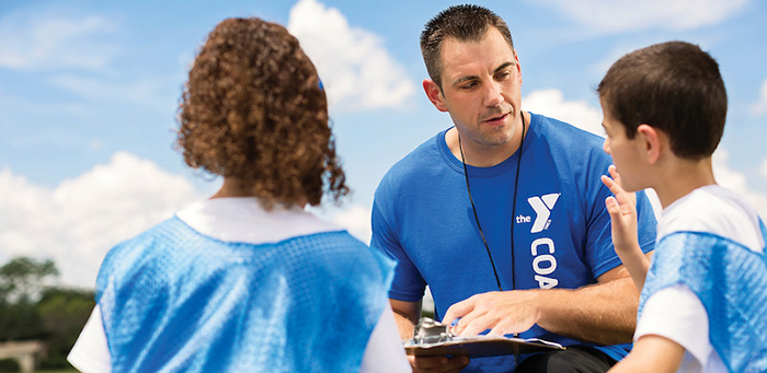 Coach talking to his team