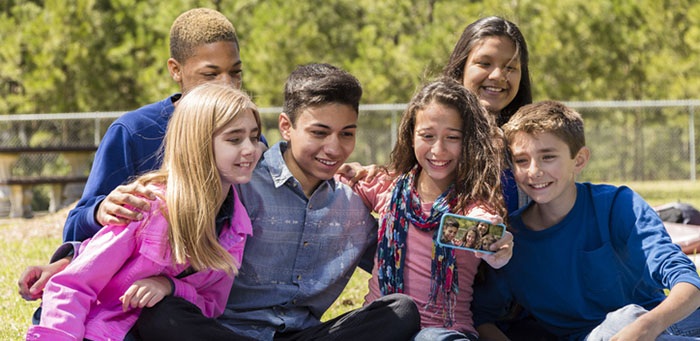 Teenagers taking a selfie