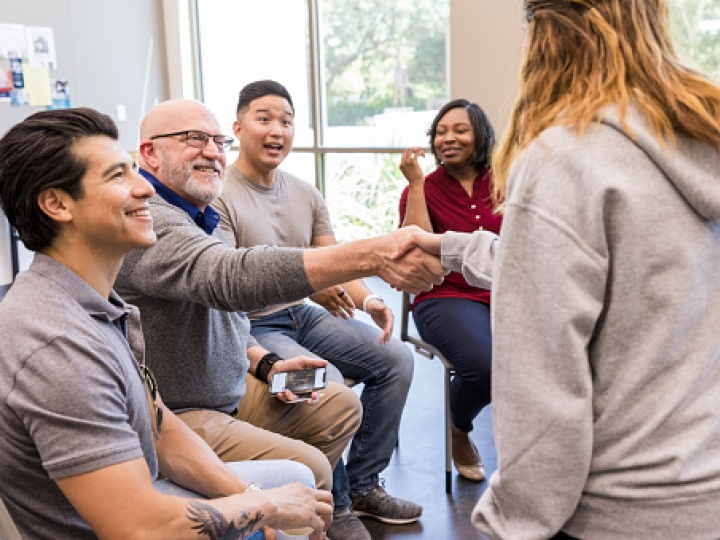 A group of people gain support at a YMCA