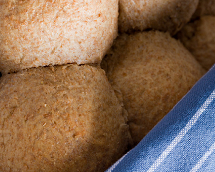 Wheat bread rolls wrapped in a blue cloth Wheat bread rolls wrapped in a blue cloth