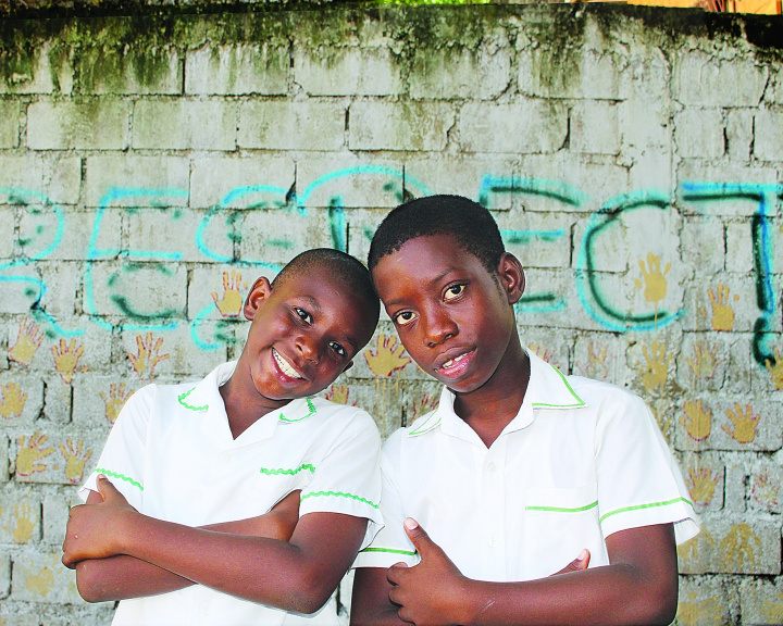 Two young kids pose together to represent global services