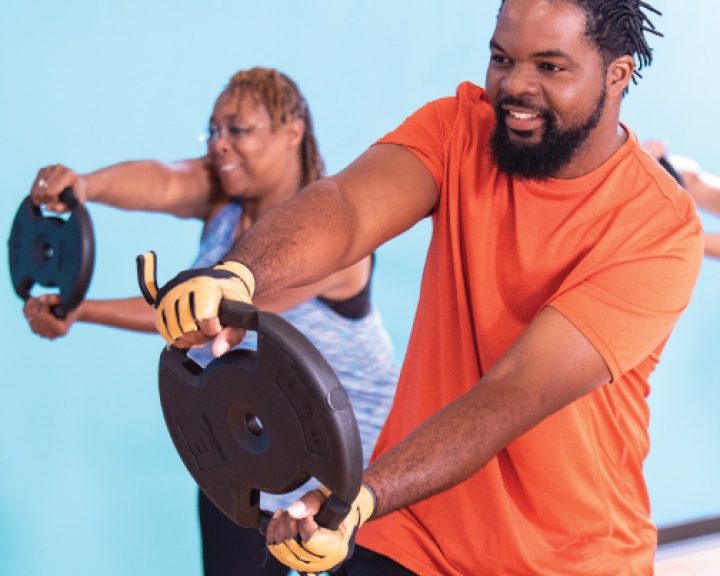 Man holding weight at YMCA class Man holding weight at YMCA class