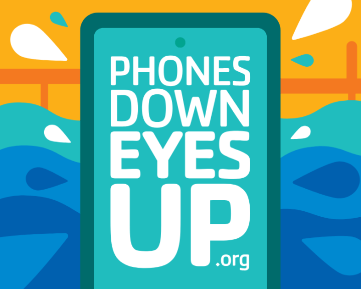 Phones Down Eyes Up text on a phone with an illustrated water background