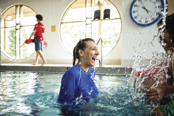 Instructor splashing students - YMCA