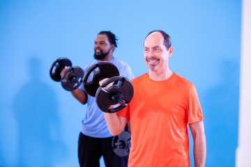 Two men weight training together - YMCA