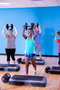 Group fitness class lifting weights -n. YMCA