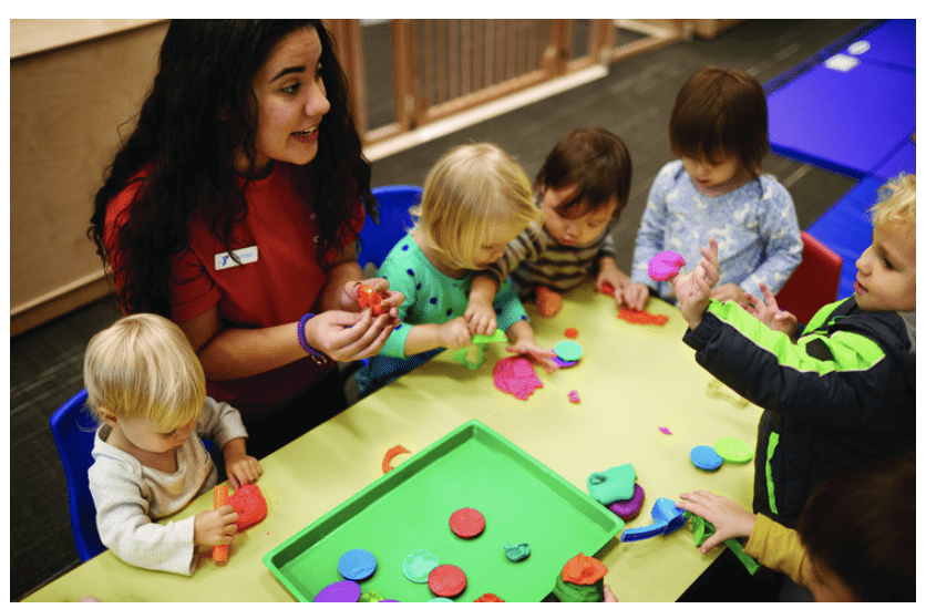 YMCA child care worker with kids