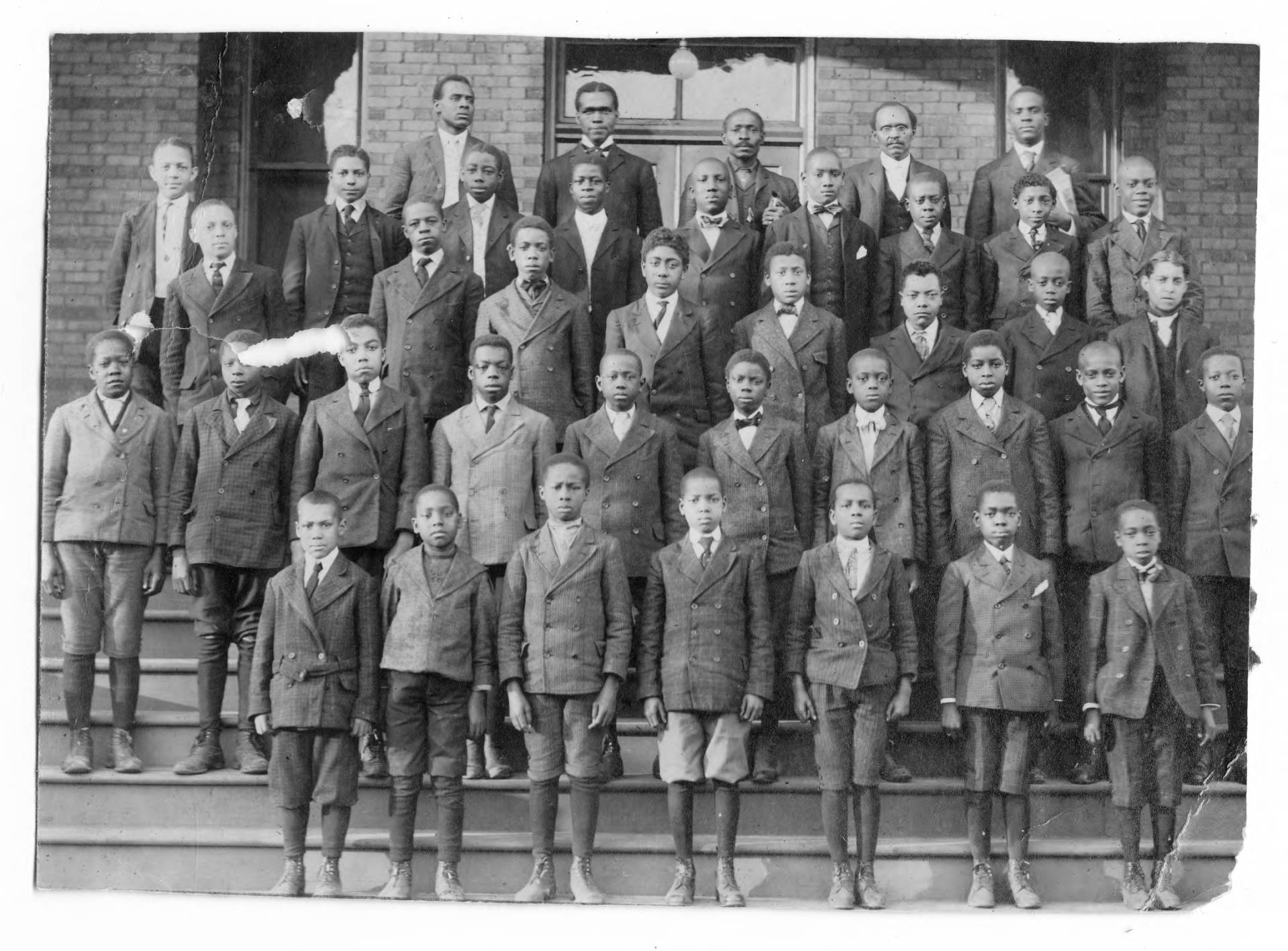 African American men standing on stairs at YMCA in 1910 African American men standing on stairs at YMCA in 1910