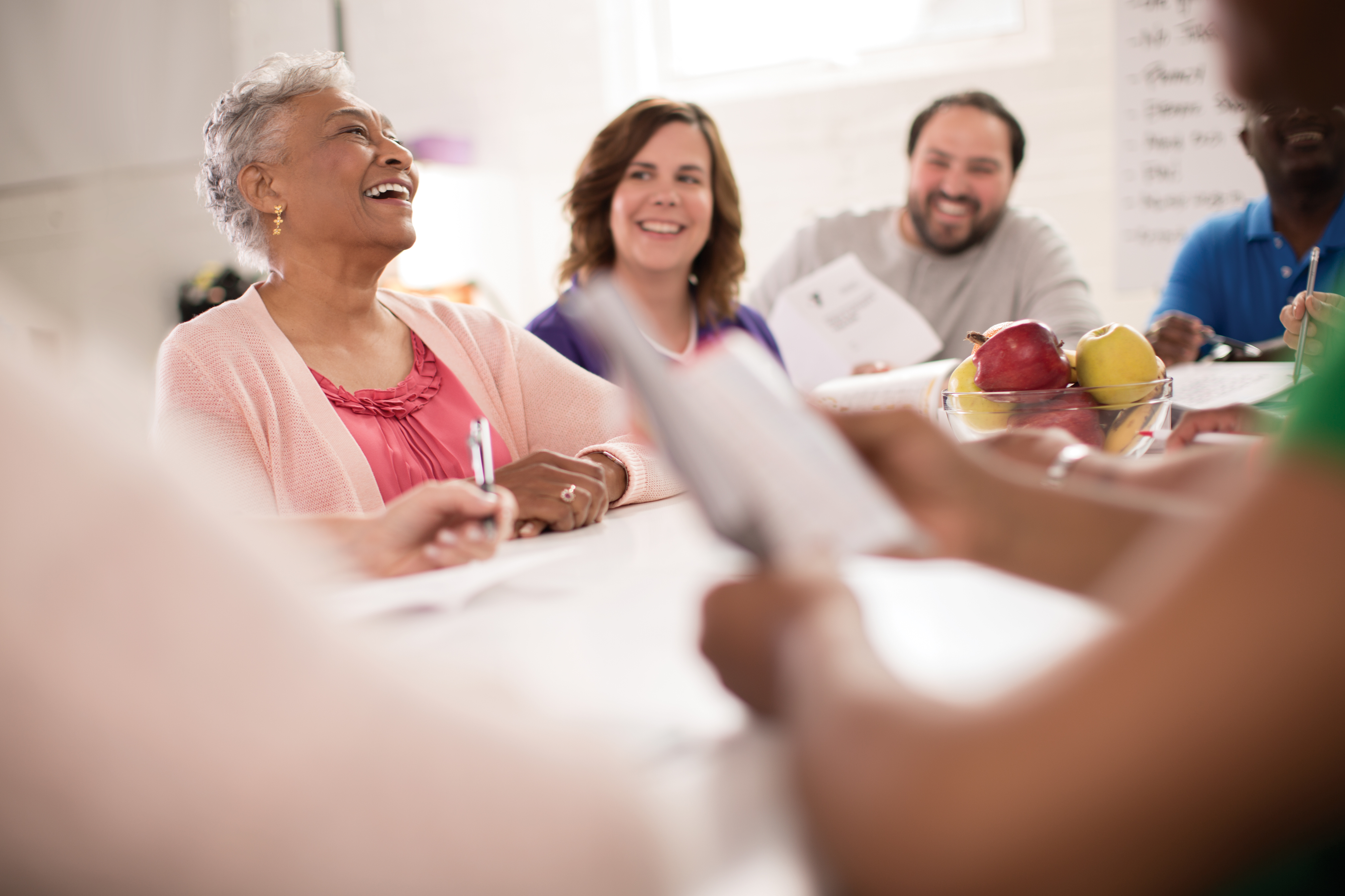 Adults having discussion at table Adults having discussion at table