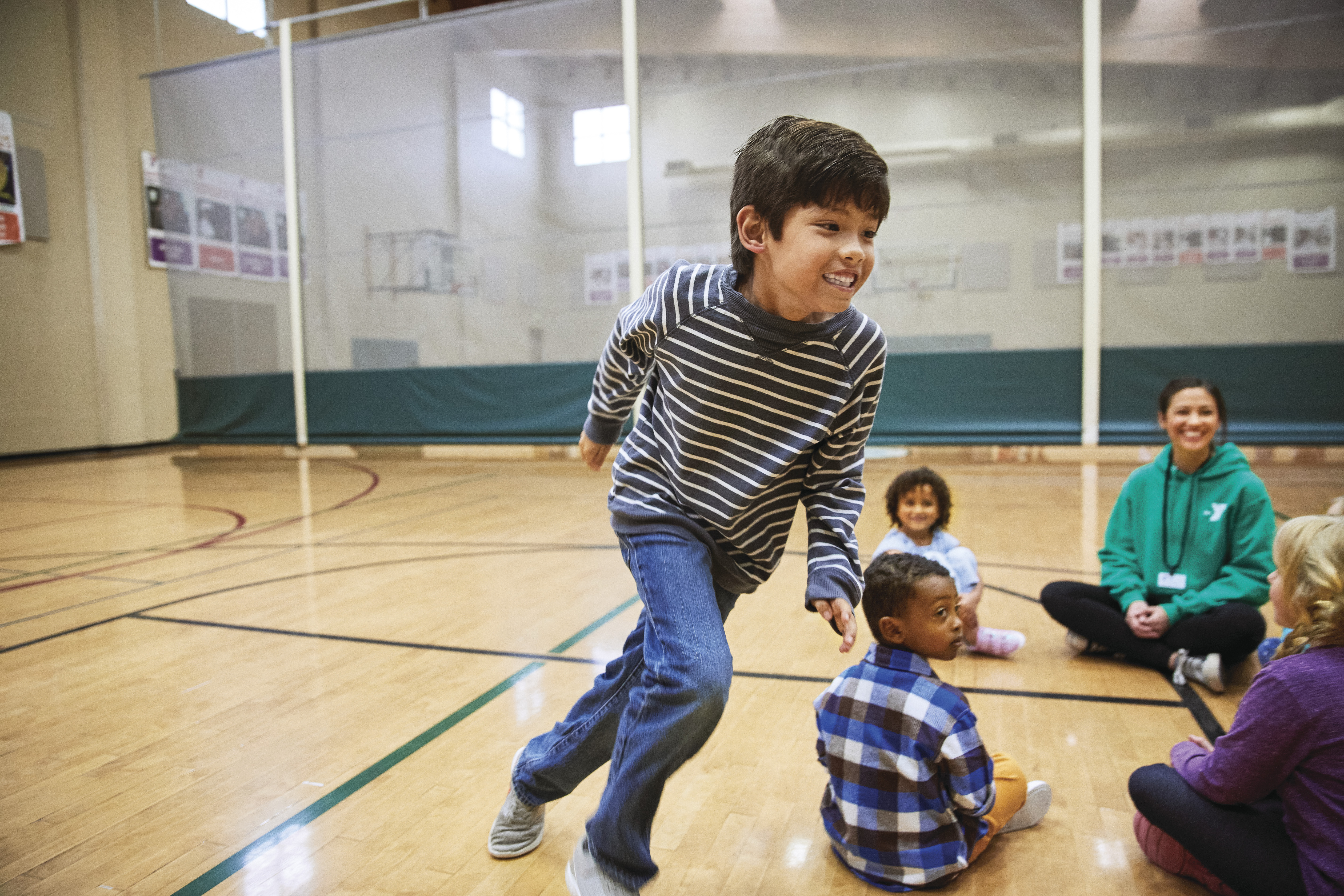 group of children playing in YMCA gymnasium group of children playing in YMCA gymnasium