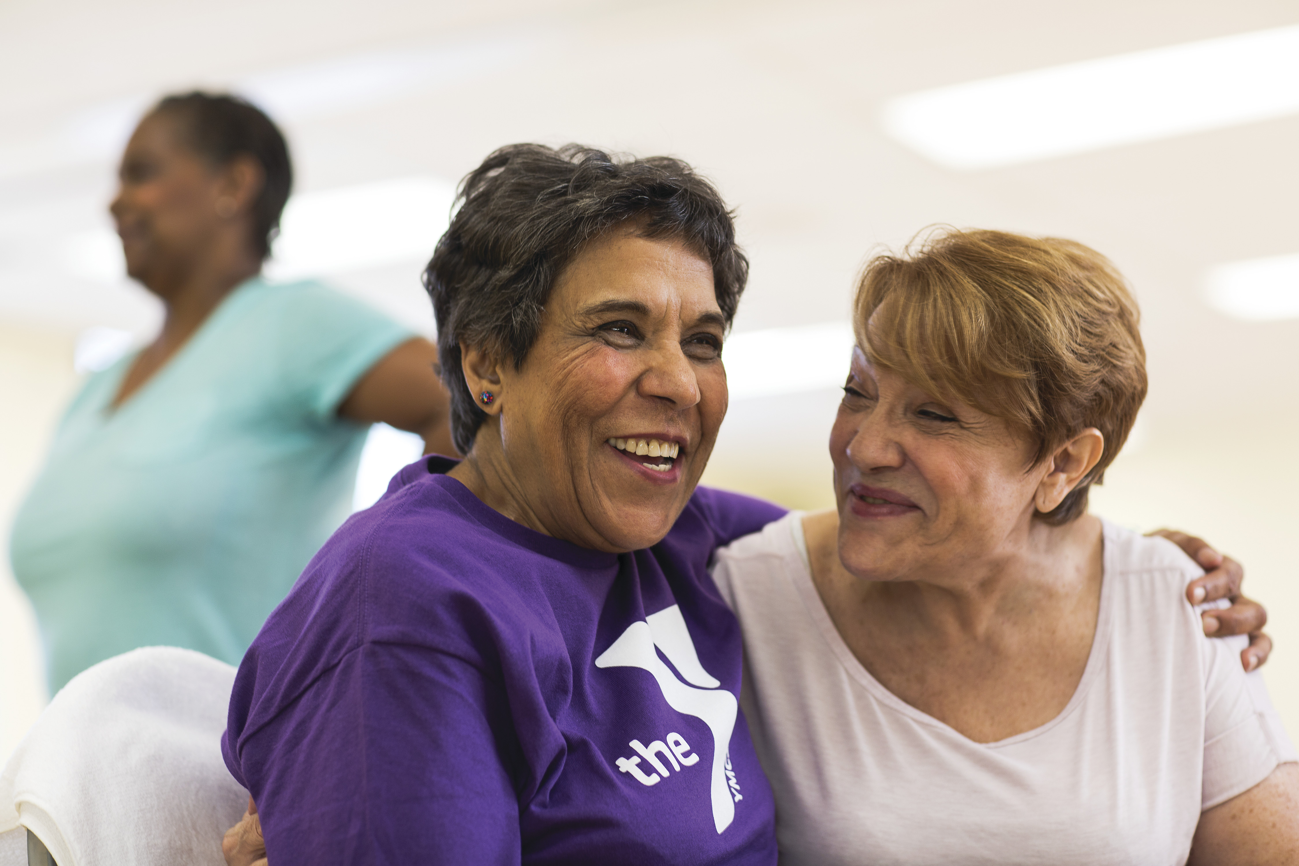 Two adults hugging at YMCA Two adults hugging at YMCA