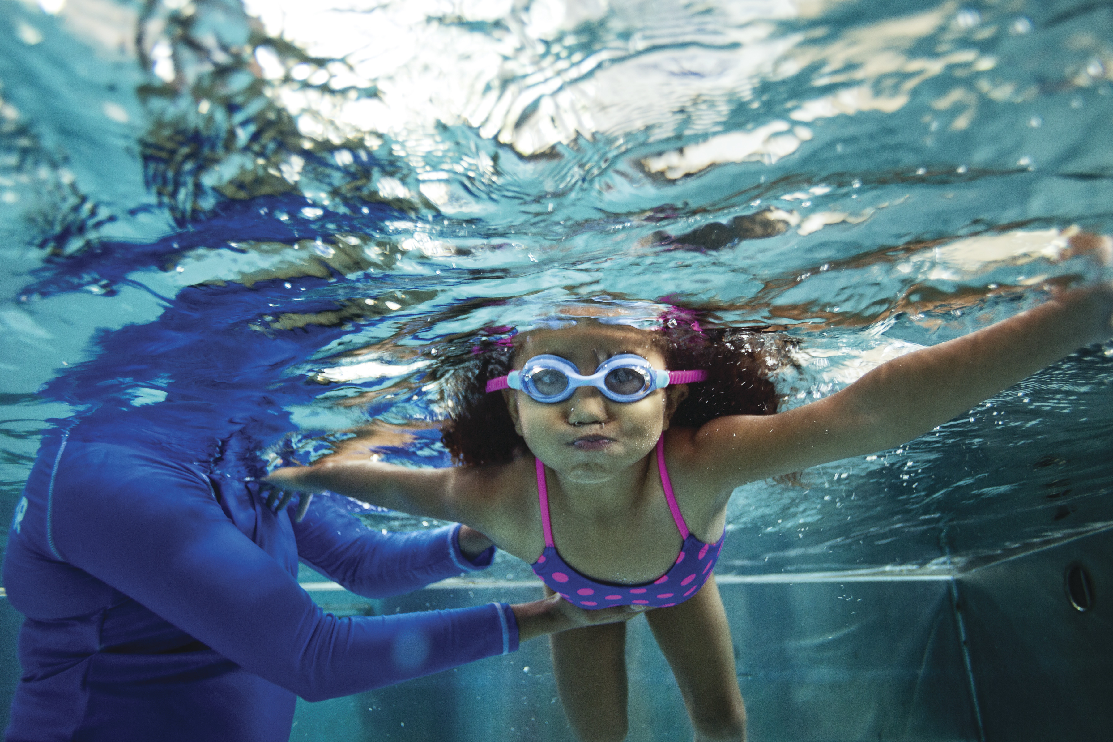 Youth learning to swim with face under water -YMCA Youth learning to swim with face under water -YMCA